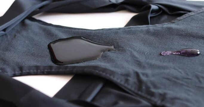 Comfortable, sustainable period underwear: black menstrual pants absorbs pink liquid fast.Eco, reusable concept.High front and back protection of gusset from any type of bleeding, breathable. Close up