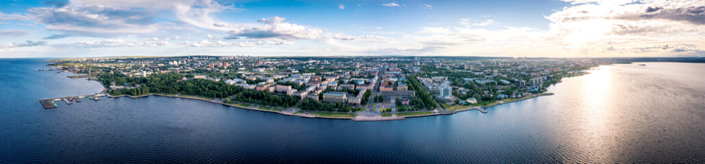 Fototapeta na wymiar Aerial panorama of the embankment of Petrozavodsk., Russia, the administrative center of Republic of Karelia. Sunset on Lake Onega