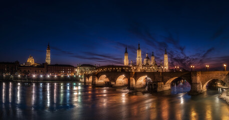 Fototapeta premium Basilica del Pilar in Zaragoza, beautiful touristic destination with different angles night day blue hours and reflections