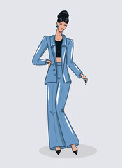 Stylish woman in a blue suit posing