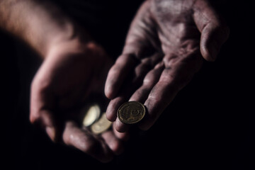 Man hands holding USSR rubles, money on a black background, close-up. Soviet Union cash in the dirty hands of a poor man on a dark background