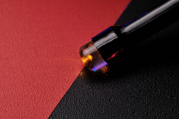 Close-up of an LED light bulb on a red-black background. Selective focus.