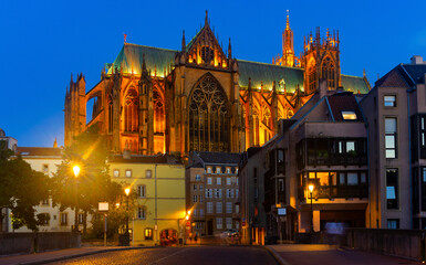 Night view of gothic cathedral of Metz illuminated by yellow light. Roman Catholic cathedral in...