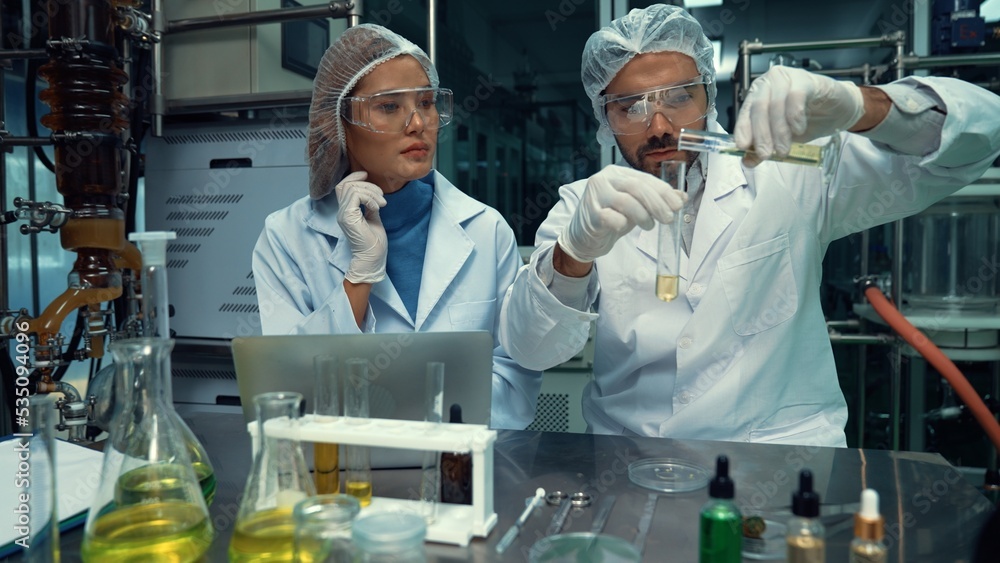 Poster two scientist in professional uniform working in laboratory for chemical and biomedical experiment