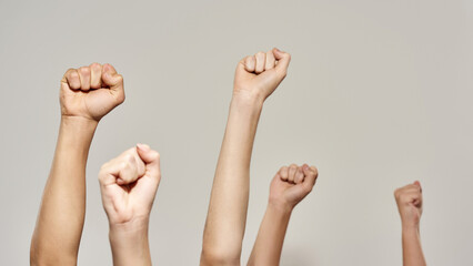 Cropped hands with fists during political rally