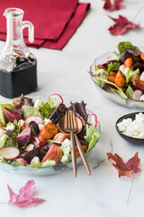 Roasted beet and carrot salad served with feta and balsamic dressing.