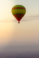 hot air balloon flying over the Moroccan desert and the atlas mountains