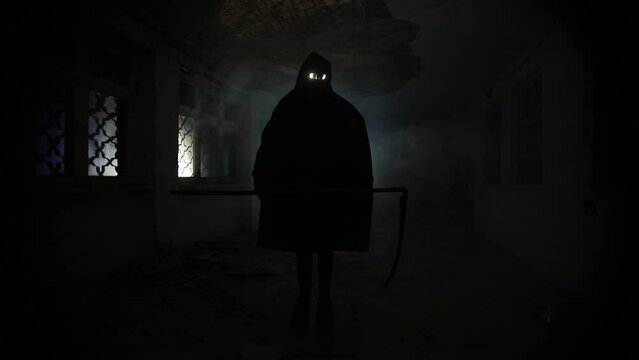 death with scythe standing in the dark hall. Horror silhouette inside ruined building