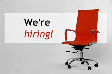 We`re hiring! Red office chair on light grey background