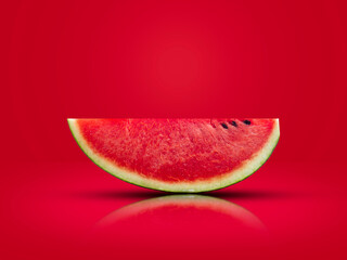 sliced watermelon put on a red background The image is ready for use in advertising.
