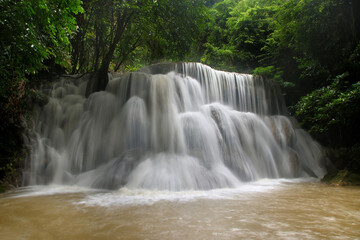Fototapeta na wymiar beautiful waterfall in green forest