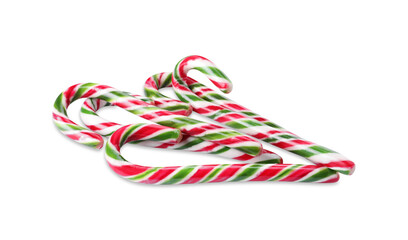 Sweet Christmas candy canes on white background