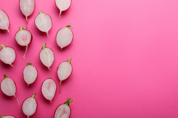 Fototapeta na wymiar Fresh ripe radish on pink background, flat lay. Space for text
