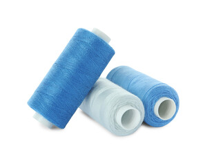 Different colorful sewing threads on white background