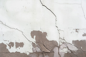 house broken. concrete crack. Water damage building interior. large crack white concrete wall