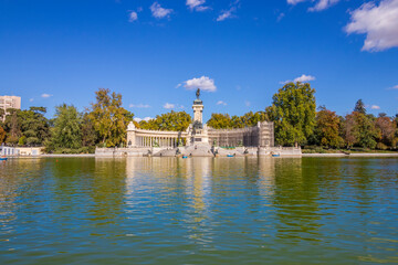 Fototapeta na wymiar Monumento a Alfonso XII (Monument to Alfonso XII), in Parque del Buen Retiro (The Buen Retiro Park), in front of Estanque Grande del Buen Retiro, Madrid, Spain.