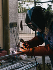 Fototapeta premium Iron soldering, Man working on iron soldering, welding sparks
