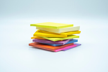 Multicolored sticky notepads on white tabletop