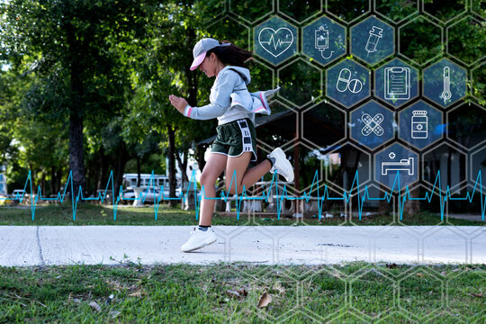 Sporty woman runner in shadow on a natural background, image of attractive woman in modern sportswear, dynamic movement, side view, sports and a healthy lifestyle.