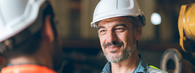 professional industrial engineers in hard hats. working at heavy industry manufacturing factory, man worker in an construction industrial job, maintenance service check for safety first concept