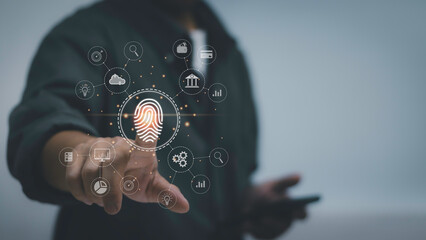 concept of authentication technology to access personal information with safety , man touch fingerprint scanner icon on virtual screen. Login to online for access applications or various transactions