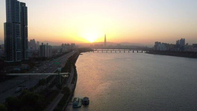 aerial view of highway traffic along han river and sunrise in seoul city south korea