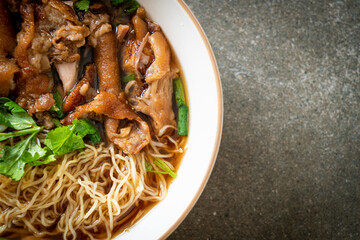 Stewed pork leg noodles in brown soup