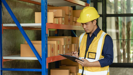 Asian man managing warehouse worker man holding tablet in warehouse Logistics network distribution and intelligent logistics, import, export, and industrial concepts..box transport