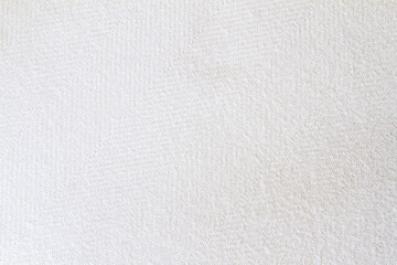 Texture of  white woven fabric; close up of cream colored textile cloth