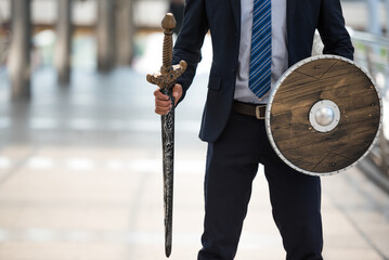 2023 New Year, Business Warrior, Business Man holding sword and shield get ready to fighting in...