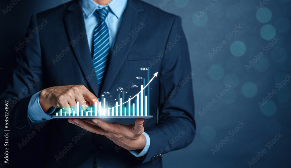 Poster Businessman using tablet to analyze sales data trading and showing a growing virtual screen of statistics, graph and chart with arrow up. Stock market business growth, planing and strategy concept.