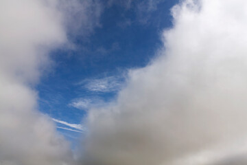 Fototapeta na wymiar Cumulus clouds in a blue sky for background and layer