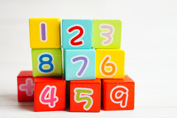 Number wood block cubes for learning Mathematic, education math concept.