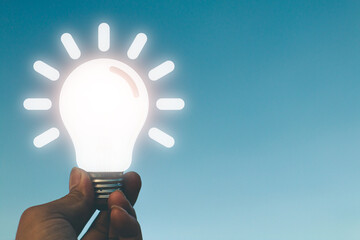 Hand holding light bulb, idea concept with innovation.