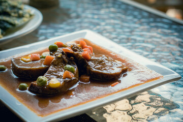 Beef tongue steak with vegetables. Concept of healthy eating.