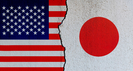 American and Japanese flags on broken cracked wall