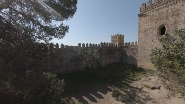 FPV aerial flies through castle window and into medieval courtyard