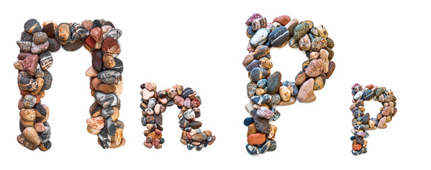 A letter of smooth stones on a white isolated background. Of the river stones lined with a letter, detailing, close-up. Selective focus