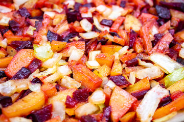 Stewed vegetables. A dish of hot vegetables. Cooking a vegetarian dish.