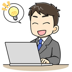 パソコンの前で閃いたビジネスマン