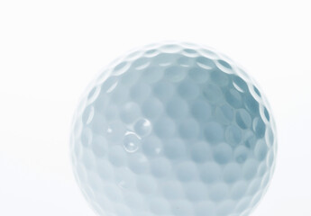 Macro shot of golf ball isolated on white background