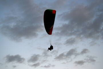 paraglider flying in the sky, paraglider in the sky,  silhouette of paraglider,