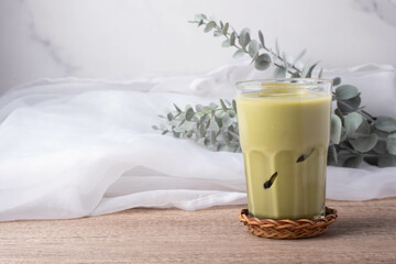Iced matcha green tea drink in a clear glass