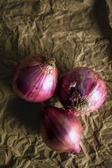 Raw red onions dark food photo style