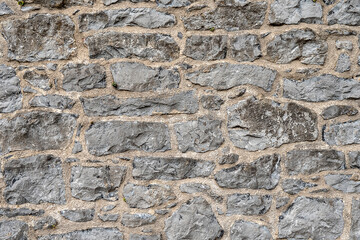 Stone wall surface texture. Background for design purpose. Grey color.