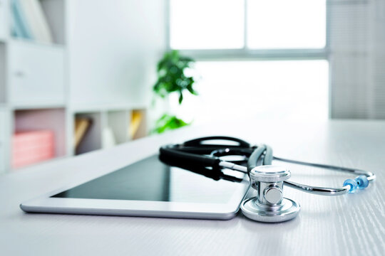 Stethoscope and digital tablet on doctor desk