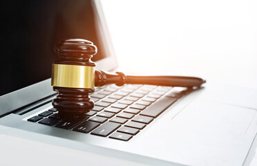 Judge gavel on laptop computer keyboard