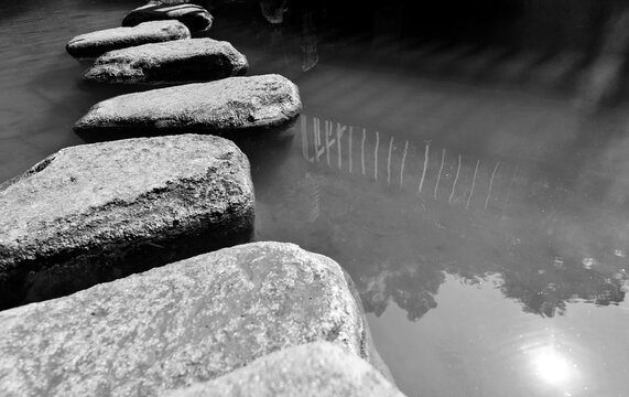 Stepping Stones Path Over A Pond