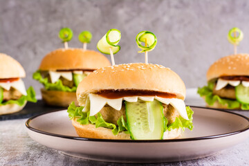 Burger monster for halloween menu on the table. Homemade creative food.