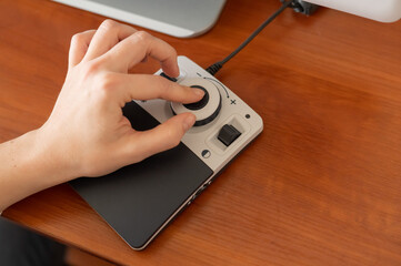 A woman uses a special magnification device for the visually impaired.